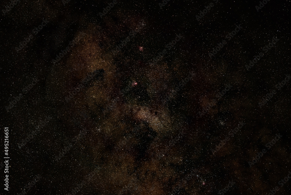 Night sky with milky way near Scutum constellation, purple Omega, Eagle and Triffid nebula visible. Long exposure stacked photo Night sky with milky way near Scutum constellation, purple Omega, Eagle and Triffid nebula visible. Long exposure stacked photo
