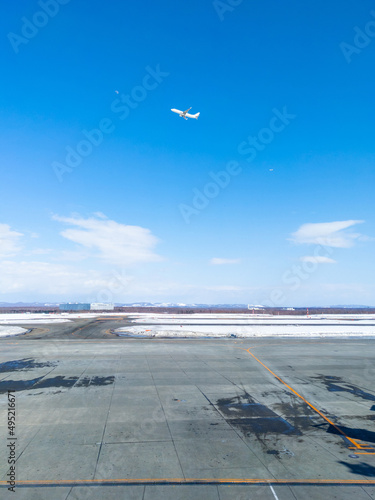 Seeing off an airplane leaving a snowy airport (Chitose, Hokkaido, Japan) photo