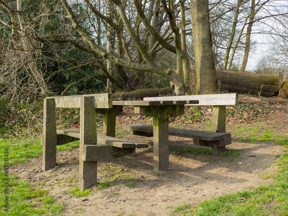 Hand crafted rustic table and benches provide an ideal picnic spot close to the Leeds and Liverpool Canal and Hirst Lock in Yorkshire