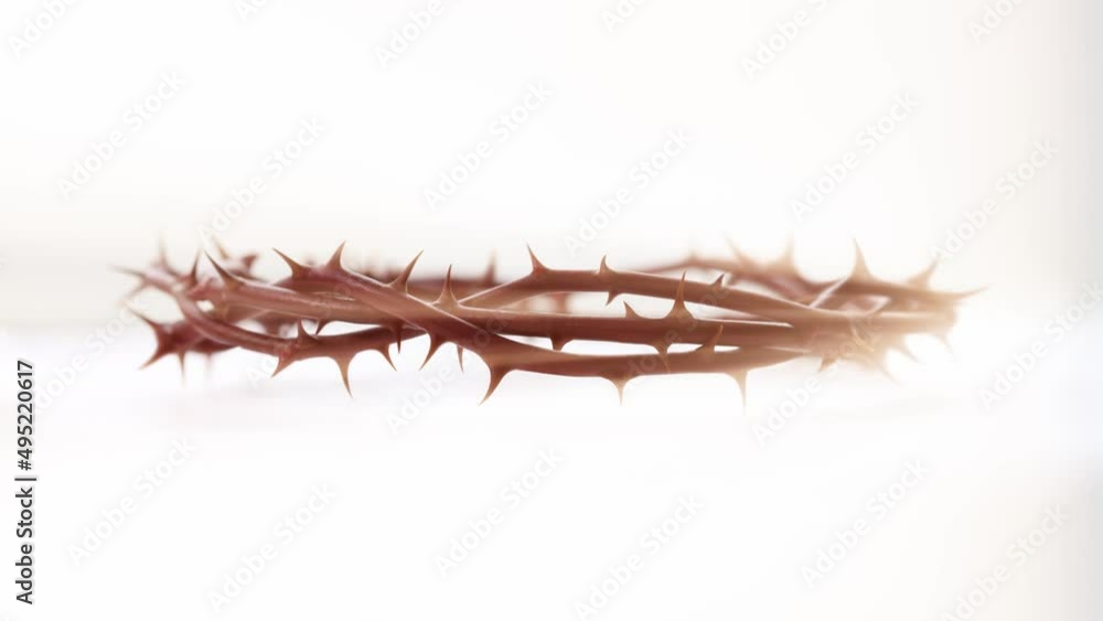 The crown of thorns symbolizing the sacrifice and suffering of Jesus Christ, the cross of the resurrection and a light background The crown of thorns symbolizing the sacrifice and suffering of Jesus Christ, the cross of the resurrection and a light background