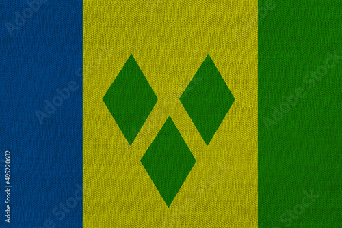 Patriotic textile background in colors of national flag. Saint Vincent and the Grenadines