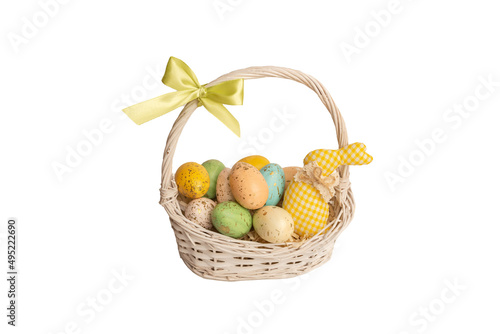Multi colors Easter eggs in the woven basket isolated on white background. Pastel color Easter eggs