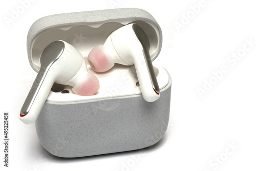Closeup pair wireless headphones case white background