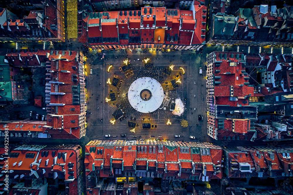 Great panoramic topdown (top down) view on the Old Town Market Square in Warsaw with a recreational skating rink and a mermaid statue during the Christmas holidays, Poland, EU