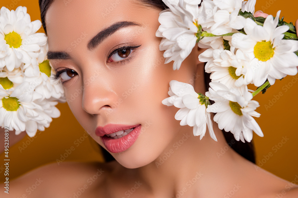 Close up photo headshot of asian pretty girl among flowers visage gentle flirt deep eyes look isolated pastel color background