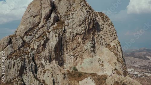 Aerial view of rock formation and little city on the foot. Mexico