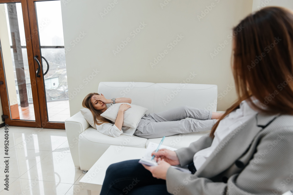 A young woman came to an appointment and consultation with a psychotherapist. Counseling and help during depression. A young woman came to an appointment and consultation with a psychotherapist. Counseling and help during depression.