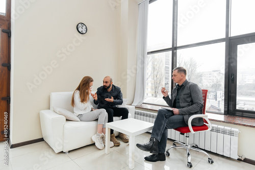 A young married couple came to an appointment and consultation with a psychotherapist. Counseling and help during depression and solving family problems.
