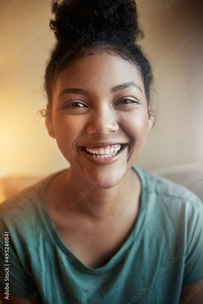 Youll always catch me smiling. Cropped portrait of a young female student studying at home. Youll always catch me smiling. Cropped portrait of a young female student studying at home.