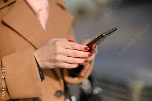 person using a mobile phone in the city