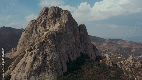 Aerial view of rock formation and little city on the foot. Mexico