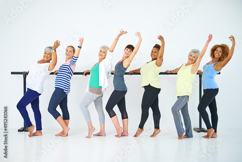 Having fun with exercise. Shot of a group of women working out indoors.