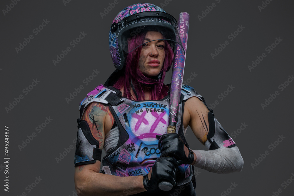 Portrait of displeased female protester with baseball bat Portrait of displeased female protester with baseball bat