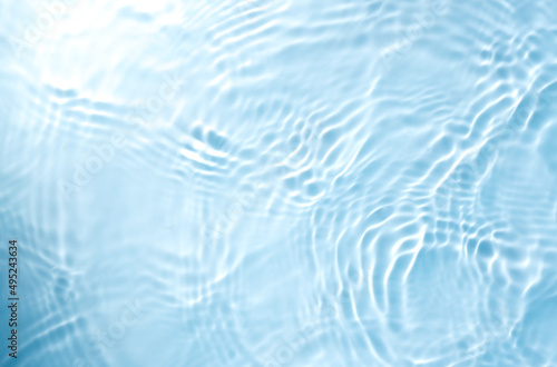 Fototapeta Naklejka Na Ścianę i Meble -  lurred transparent blue colored water surface
