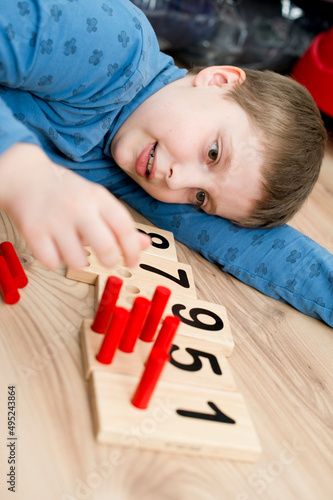Wooden figures of the Montessori methodology. Math kids counting puzzle for kids. Educational training in computing games to develop. An intelligent children's math toy. Number game board.