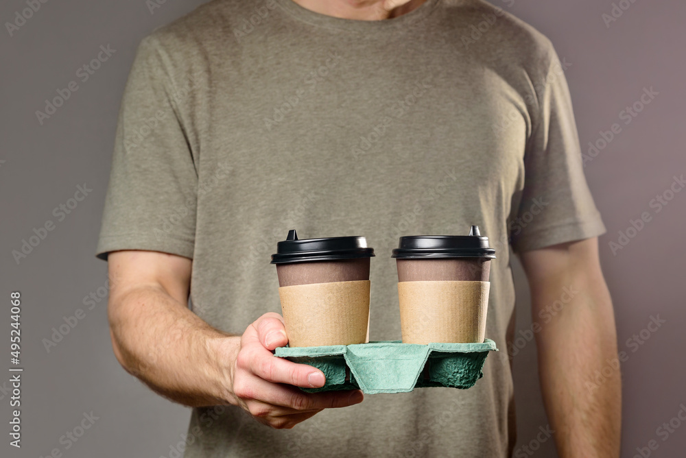 A Man Holds a Cardboard Cup Holder with Two Disposable Coffee Cups Stock  Photo - Image of disposable, invigorating: 244273058