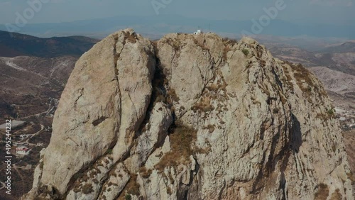 Aerial view of rock formation and little city on the foot. Mexico