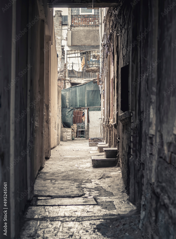 Fototapeta premium Dark narrow alley in the center of Bucharest, Romania