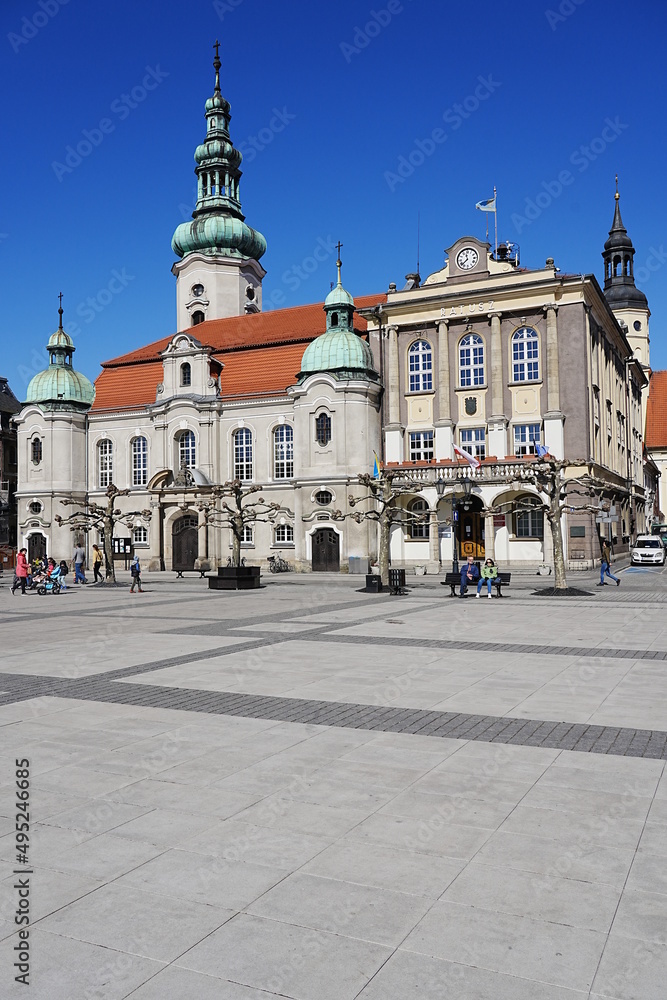 Obraz premium Church and town hall in european Pszczyna city in Poland - vertical