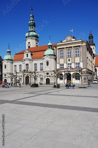 Church and town hall in european Pszczyna city in Poland - vertical
