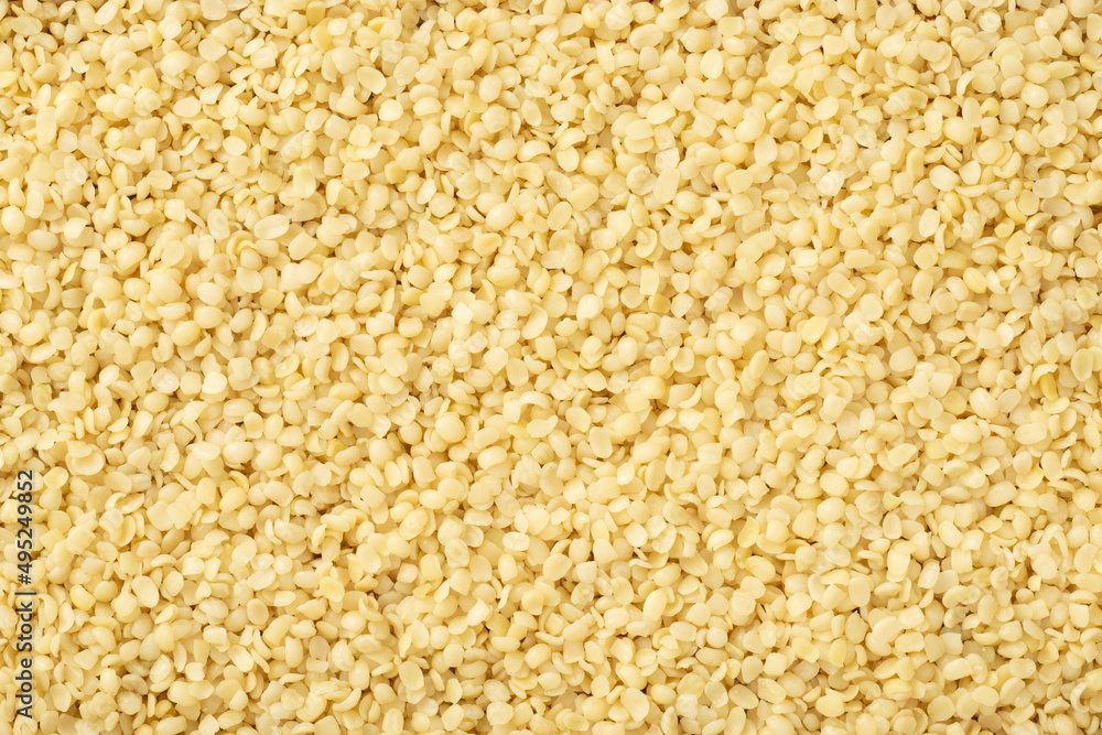 Food background of hulled hemp seeds, top view Food background of hulled hemp seeds, top view