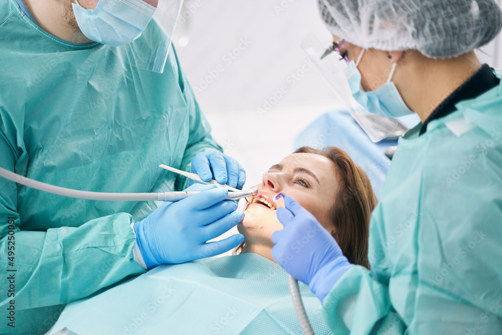Woman having dental procedure in stomatology clinic Woman having dental procedure in stomatology clinic