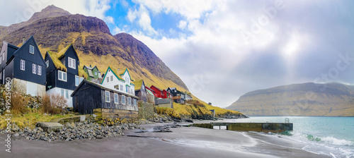 Bøur, Faroe Islands; March 19, 2022 - A view of the houses and the beach at Bøur, in the Faroe Islands. photo