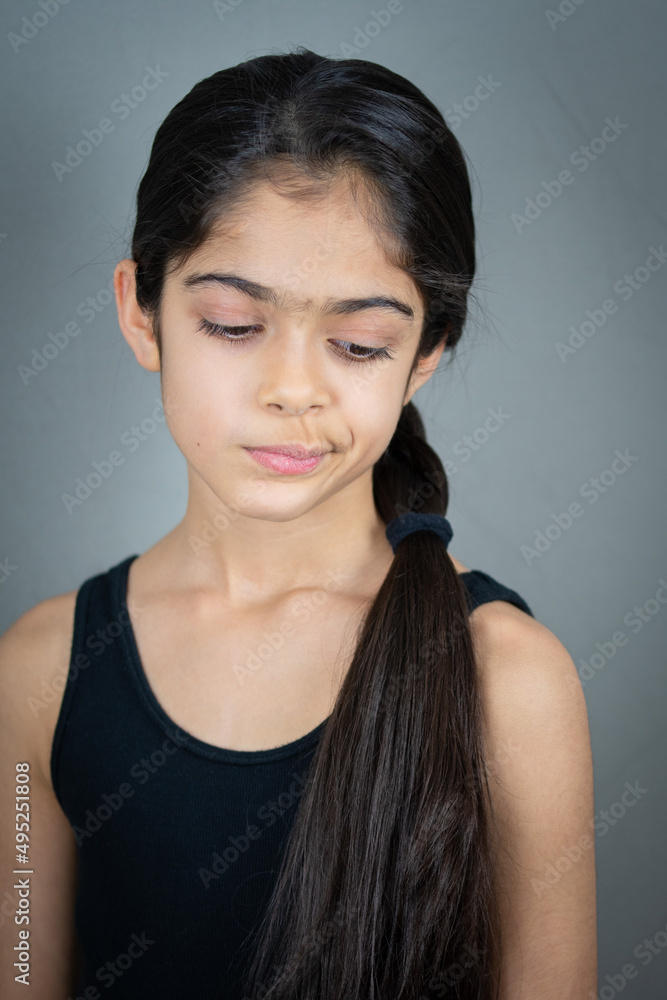 A school age Indian ethnicity girl - portrait shots with different facial expressions. A school age Indian ethnicity girl - portrait shots with different facial expressions.