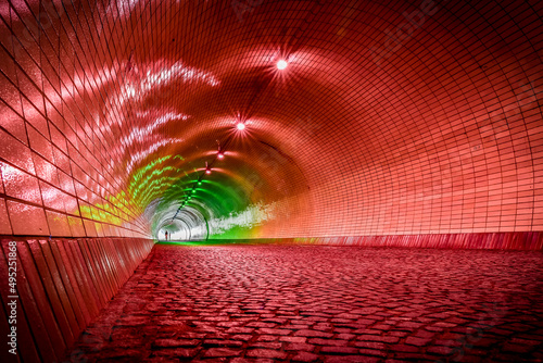 Illuminated tunnel allowing easy pedestrian and bicycle passage under the Vitkov hill. photo