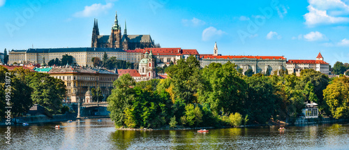 Photography Hradcany, view from the Jiraskuv Bridge over the Vltava River on a sunny day