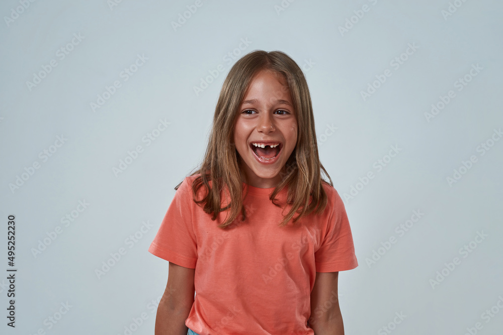 Front view of cheerful little girl with open mouth Front view of cheerful little girl with open mouth