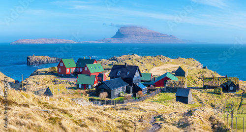 Faroe Islands; March 21, 2022 - A tiny village overlooking the island of Nólsoy, in the Faroe Islands. photo