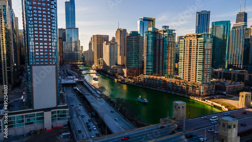 Chicago, IL USA- march 13th 2022: aerial drone shot of downtown Chicago by the river during early spring summer.  the beautiful skyscrapers look futuristic  along the green lake water
