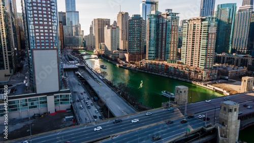 Chicago, IL USA- march 13th 2022: aerial drone shot of downtown Chicago by the river during early spring summer. the beautiful skyscrapers look futuristic along the green lake water