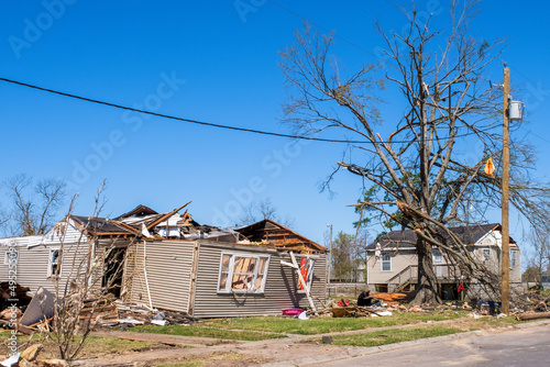 Severely Damaged House Next to Moderately Damaged House from March 22, 2022 Tornado on March 26, 2022 in Arabi, Louisiana, USA photo
