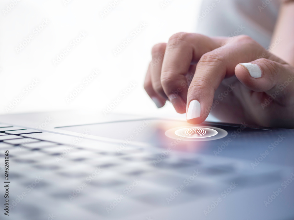 Fingerprint scan icon on touchpad on laptop computer while scanning for security access biometrics security, privacy data protection technology for business. Stock Photo | Adobe Stock