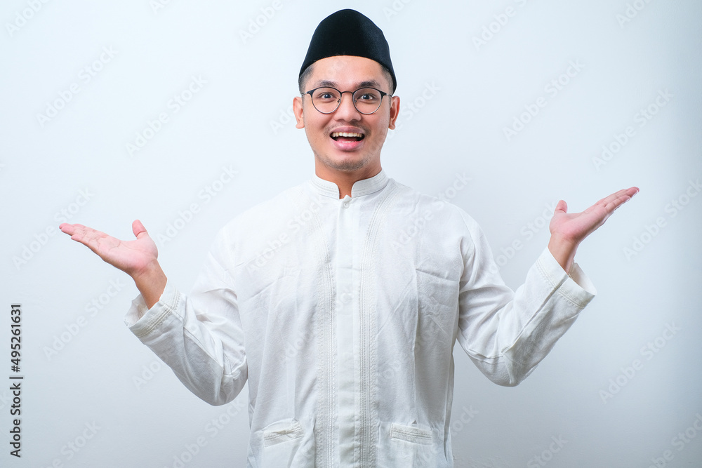 suprised man with muslim clothes looking at camera suprised man with muslim clothes looking at camera