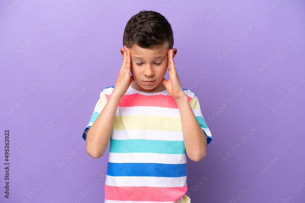 Little boy isolated on purple background with headache Little boy isolated on purple background with headache