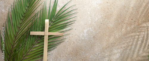 Fotografija Palm cross and palm leaves. Palm sunday and easter day concept.