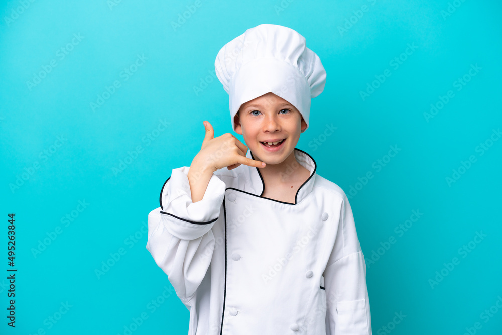 Little chef boy isolated on blue background making phone gesture. Call me back sign Little chef boy isolated on blue background making phone gesture. Call me back sign
