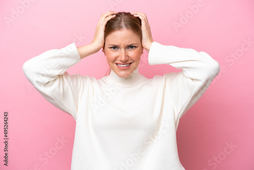 Young caucasian woman isolated on pink background doing nervous gesture
