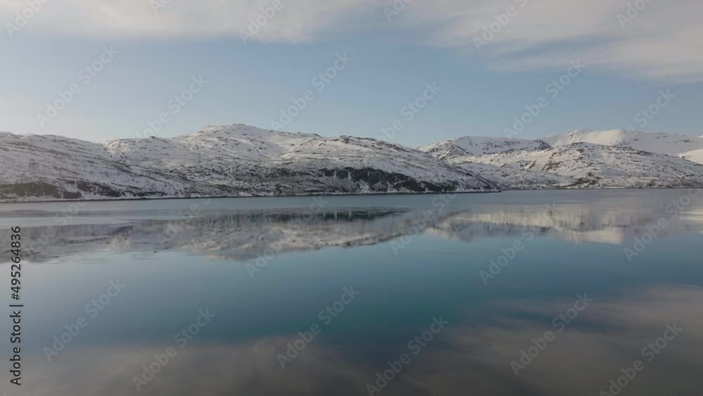 Snowy Mountains With Blue Sky Reflections On Beautiful Calm Lake In Dafjord, Ringvassoya, Northern Norway. - Wide Shot
fjord aerial, Snowy Mountains With Blue Sky Reflections On Beautiful Calm Lake In Dafjord, Ringvassoya, Northern Norway. - Wide Shot
fjord aerial,