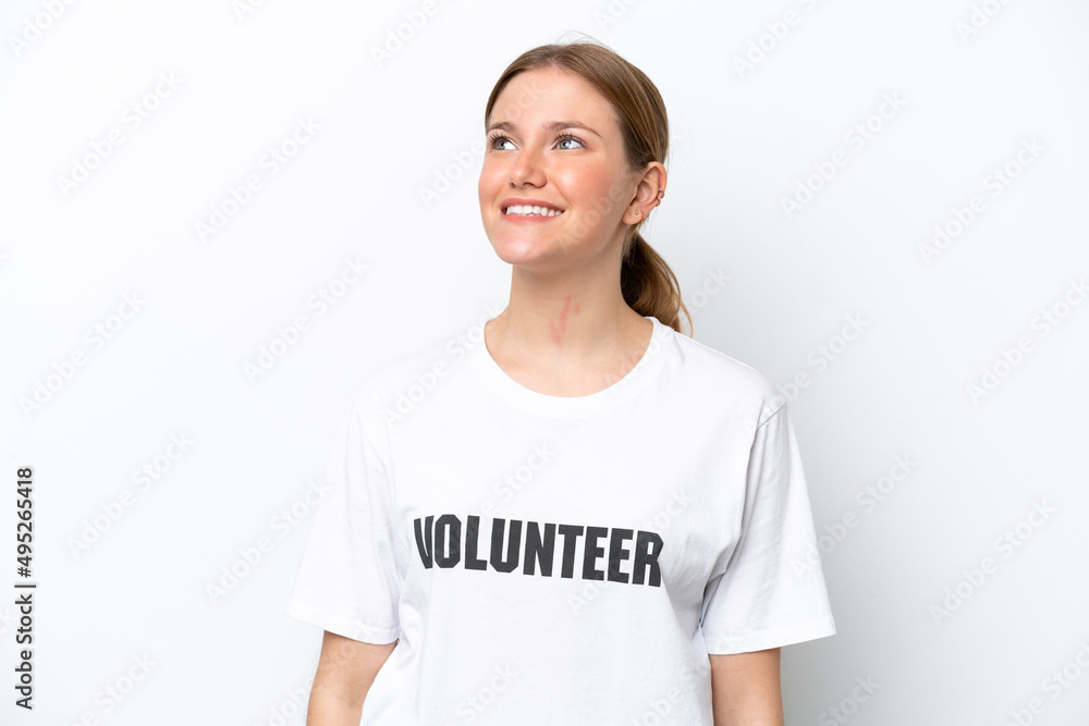 Young volunteer woman isolated on white background thinking an idea while looking up Young volunteer woman isolated on white background thinking an idea while looking up