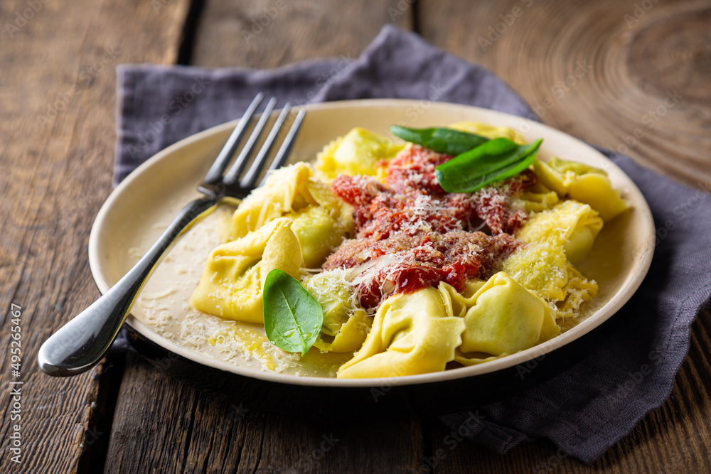 Ravioli with sauce and grated cheese Ravioli with sauce and grated cheese