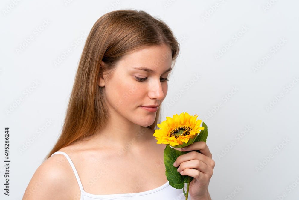 Young caucasian woman isolated on white background holding a sunflower. Close up portrait Young caucasian woman isolated on white background holding a sunflower. Close up portrait
