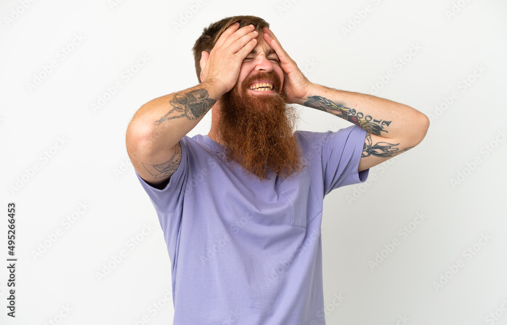 Fototapeta premium Young reddish caucasian man isolated on white background laughing