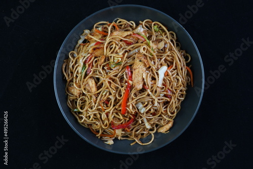Spaghetti, pasta with tomato sauce and cherry tomatoes with basil on a dark background. Selective focus, copy space. shrimp spaghetti. 