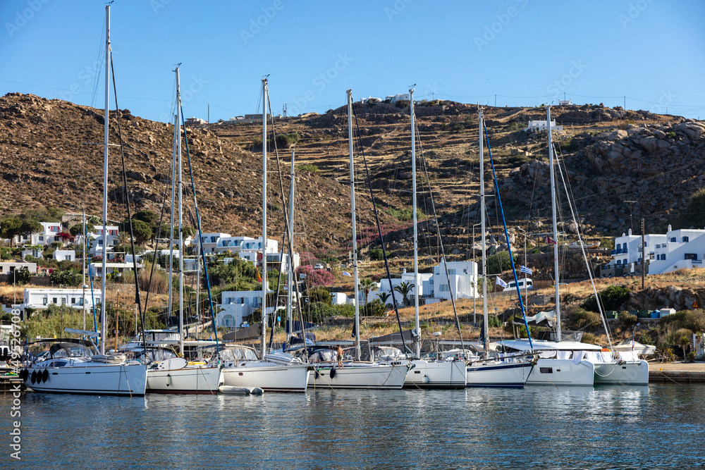 Luxury yacht, sailing boat moored at Mykonos port Greek island, Cyclades, Greece.
