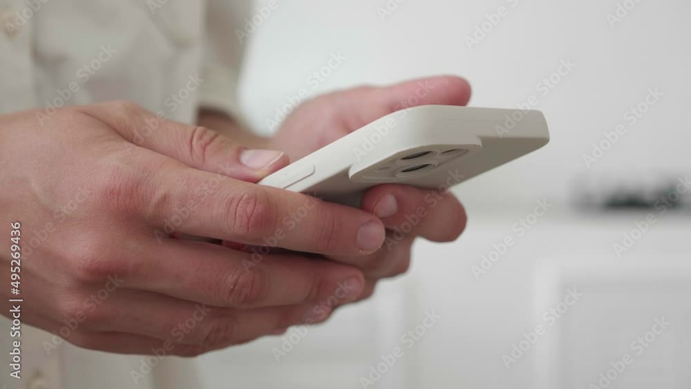 Close-up of the girl's hands using a smartphone cell phone mobile, Internet, social networks at home. Woman chooses gifts for her loved ones online, shopping online. Close-up of the girl's hands using a smartphone cell phone mobile, Internet, social networks at home. Woman chooses gifts for her loved ones online, shopping online.