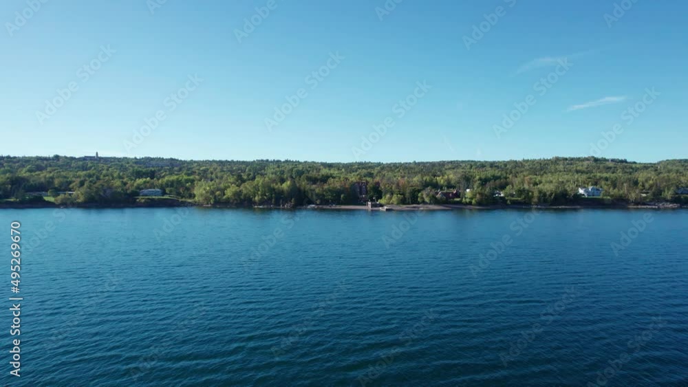 Drone aerial view zooming in on the Lake Superior shoreline in fall Drone aerial view zooming in on the Lake Superior shoreline in fall